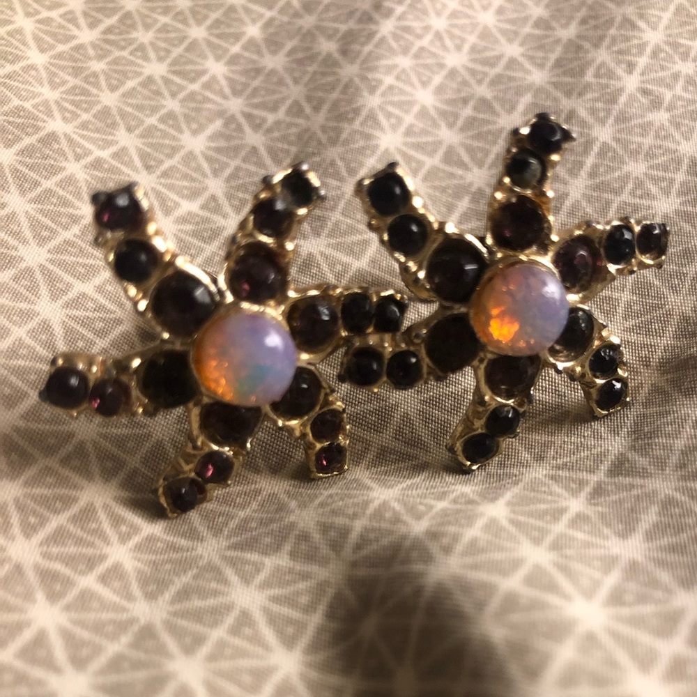 Interesting vintage earrings. Missing one stone.